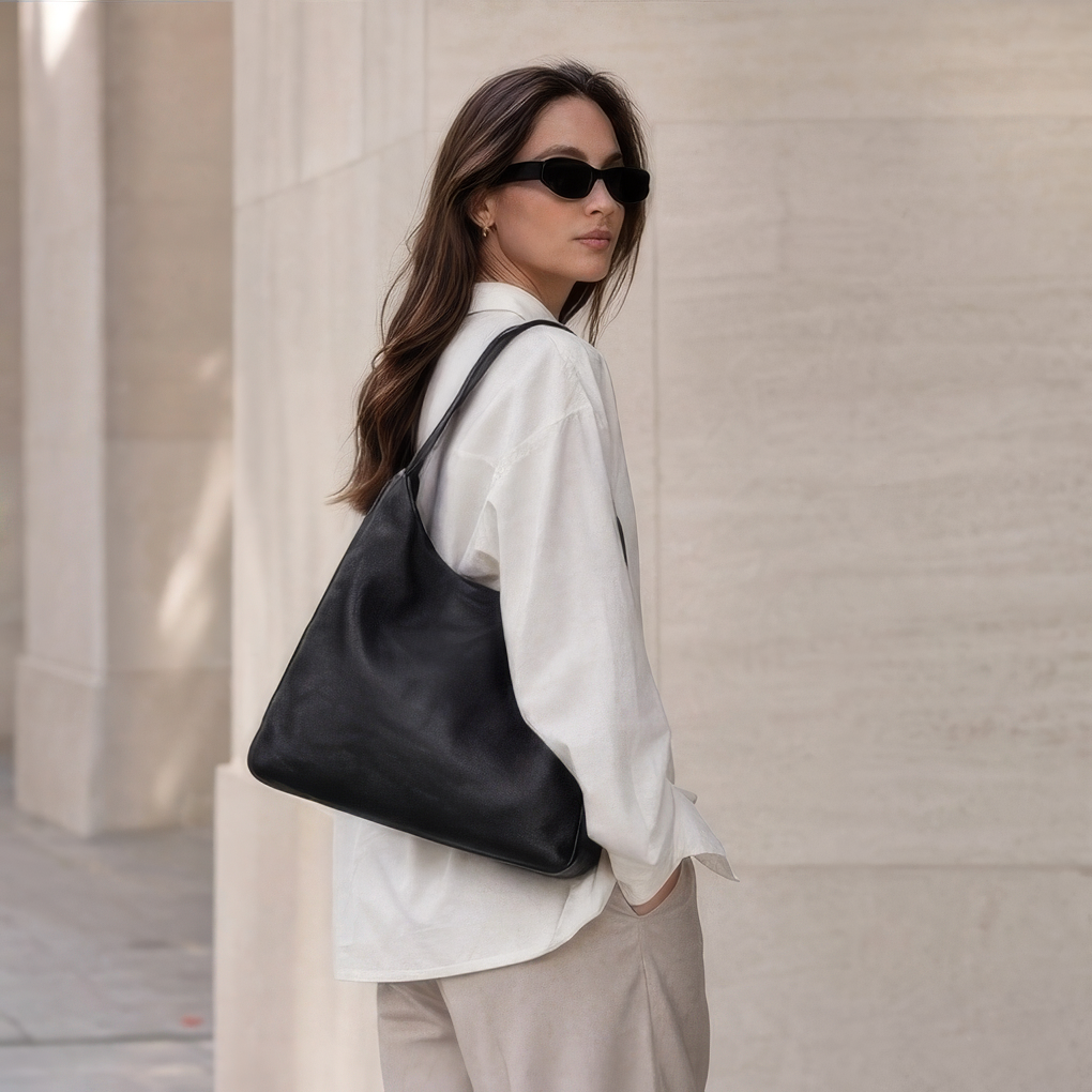 Model carrying The Overtime Lite over the shoulder -Black
