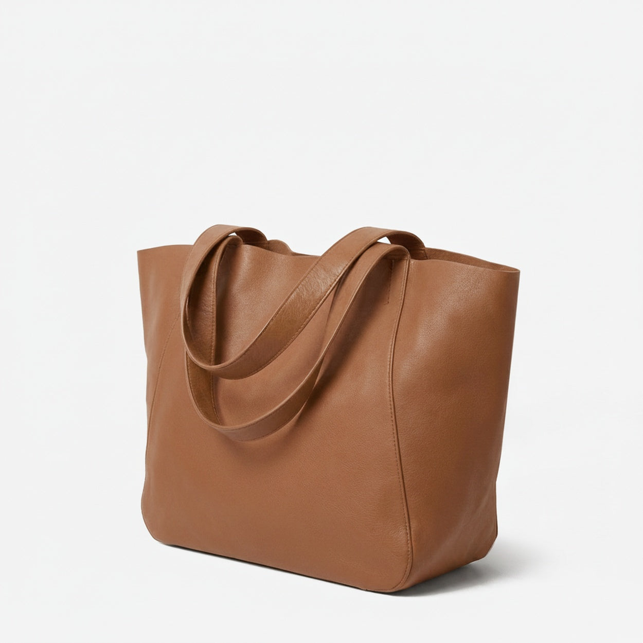 Brown leather tote bag on a light gray background - Saddle