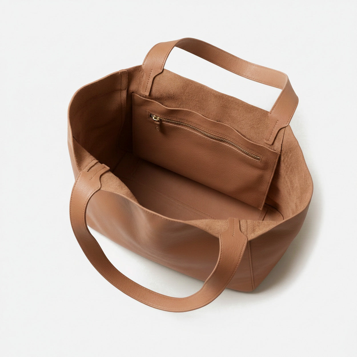 Brown leather handbag on a white background - Saddle