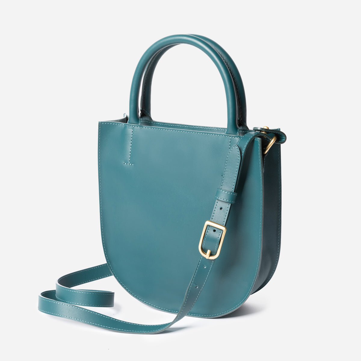 Teal handbag with a strap on a light gray background - Dawn