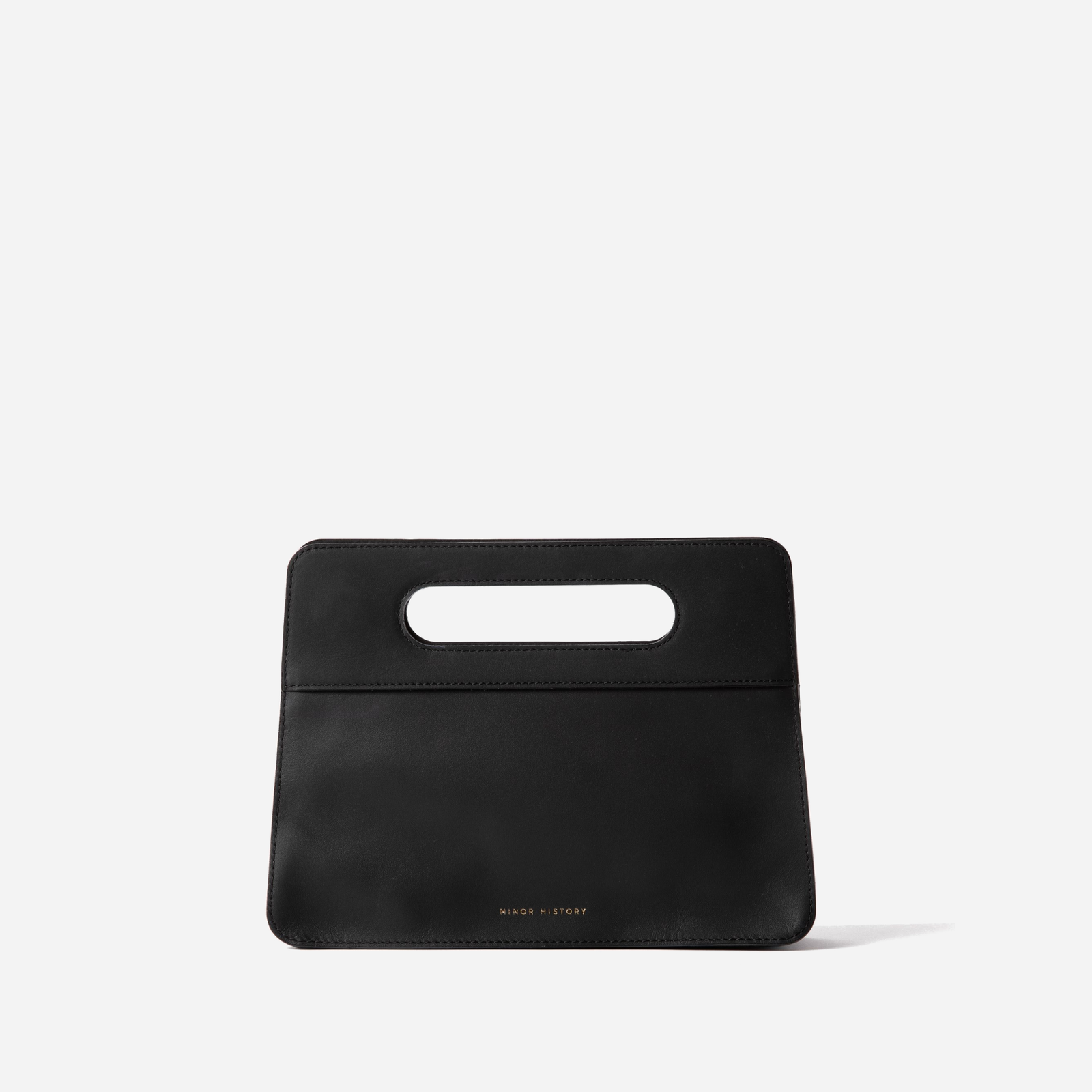 Lifestyle photo of Minor History leather bag - warm toned editorial setting  - Black