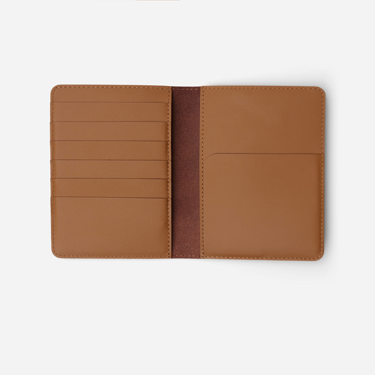 Atlas passport holder in saddle brown full-grain leather, open view showing organized card slots and compartments - Saddle