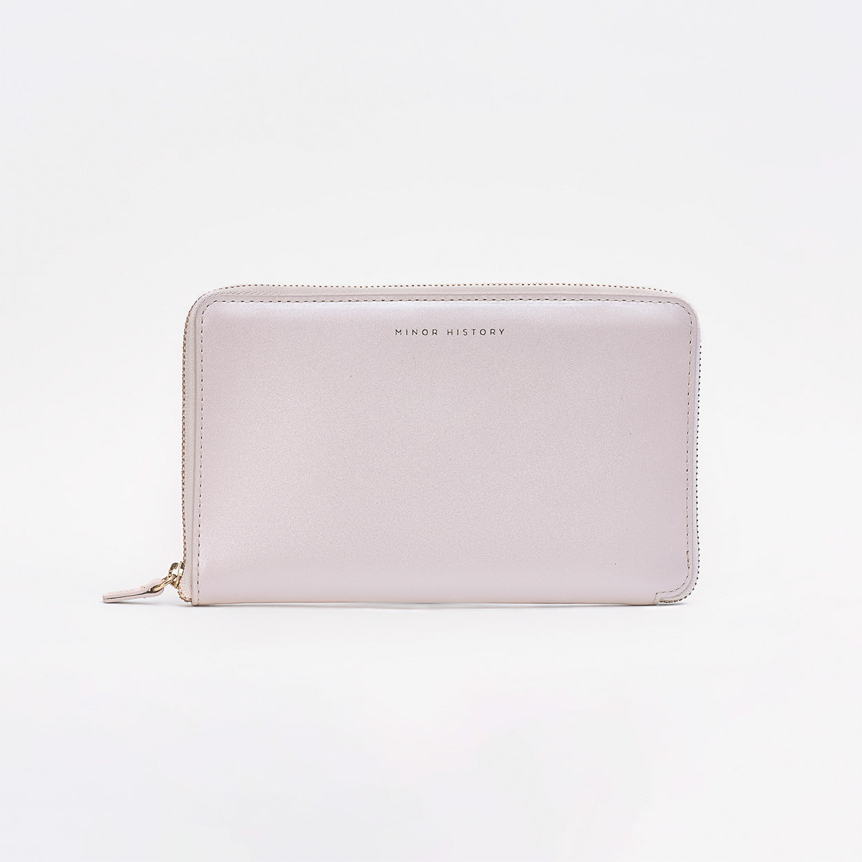 Black wallet with gold zipper on a light gray background - Black