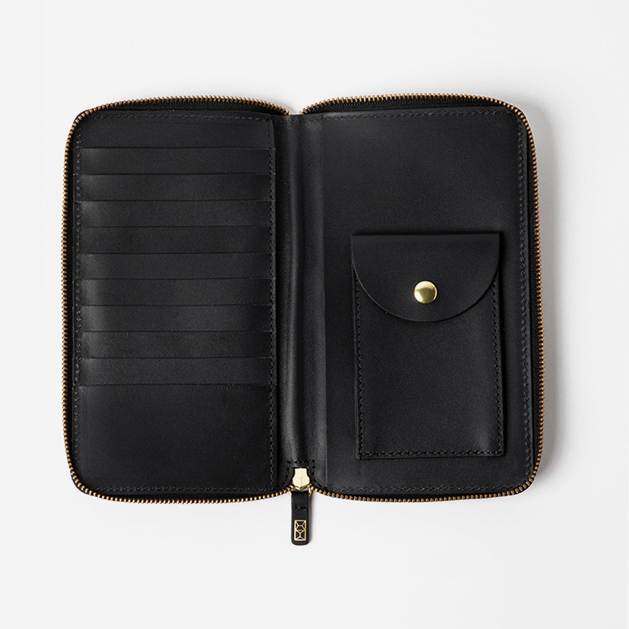 Black wallet with gold zipper on a light gray background - Black
