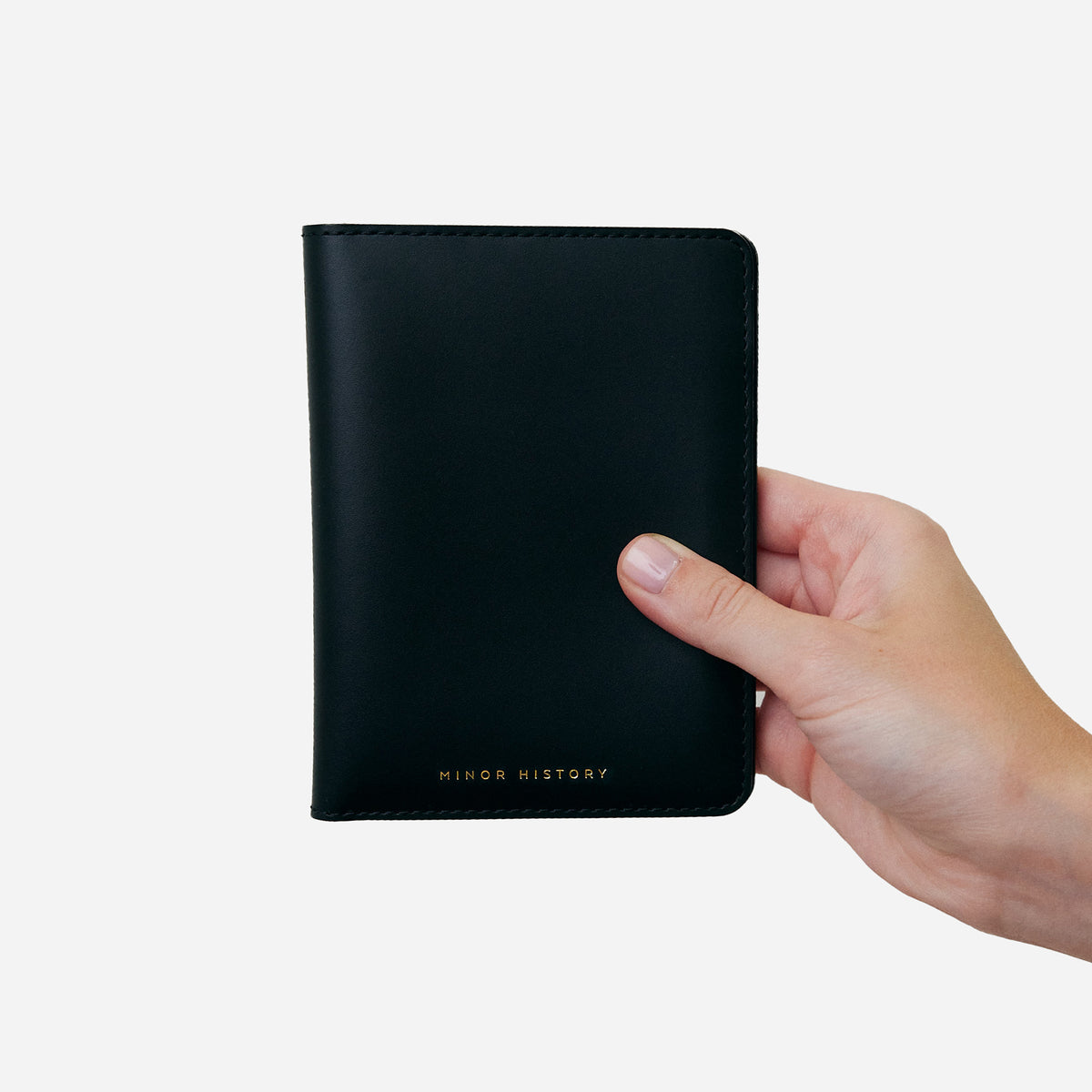 Atlas passport holder in black full-grain leather, side view highlighting slim profile - Black