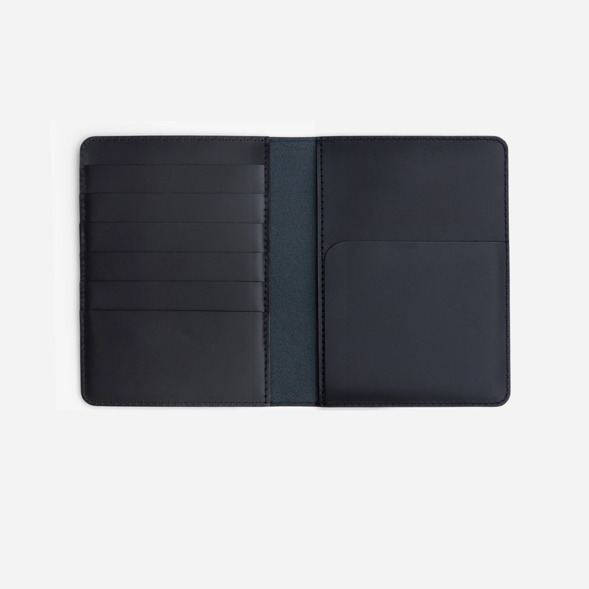 Atlas passport holder in black full-grain leather, side view highlighting slim profile - Black