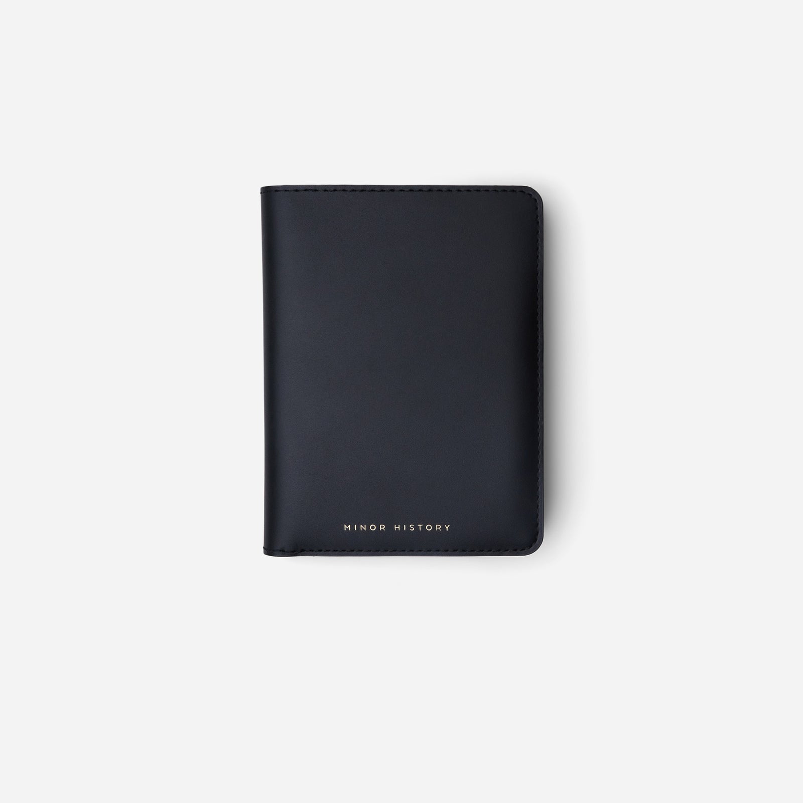 Atlas passport holder in black full-grain leather, side view highlighting slim profile - Black