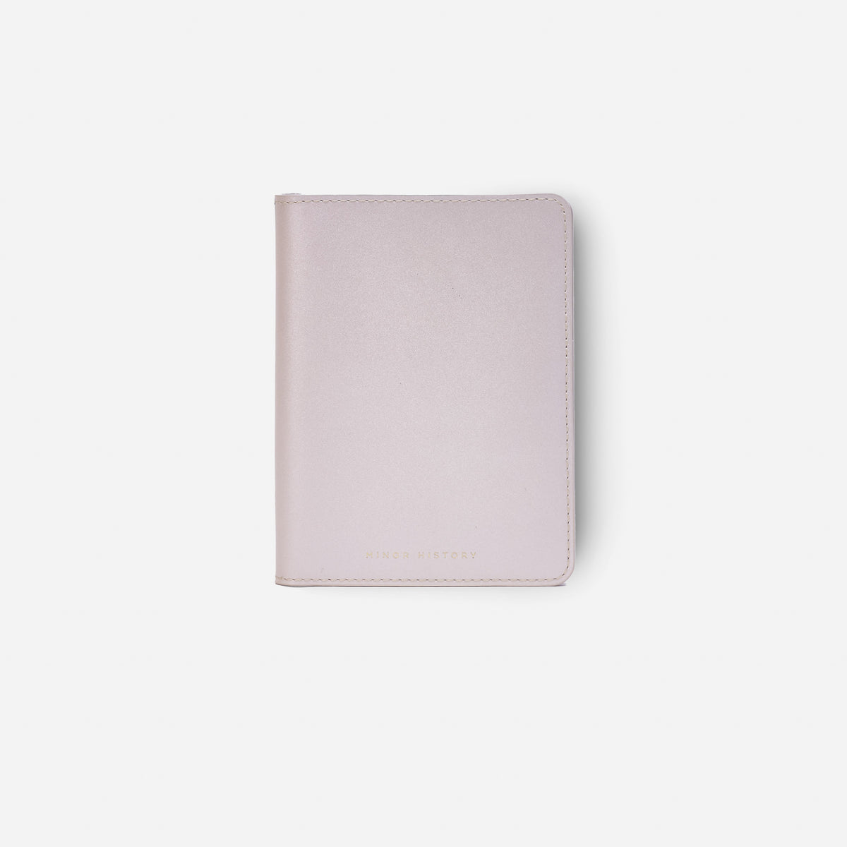 Atlas passport holder in pearl white full-grain leather, side view highlighting slim profile - Pearl