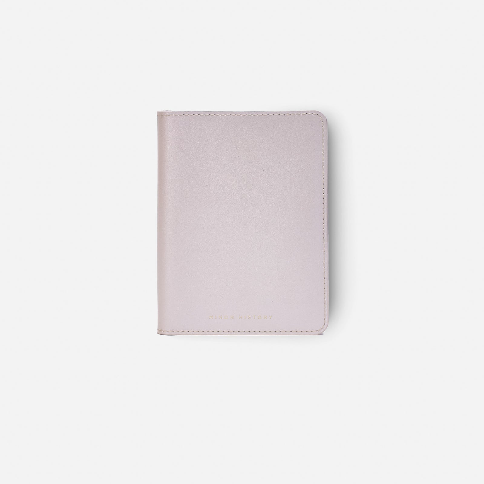 Atlas passport holder in pearl white full-grain leather, side view highlighting slim profile - Pearl