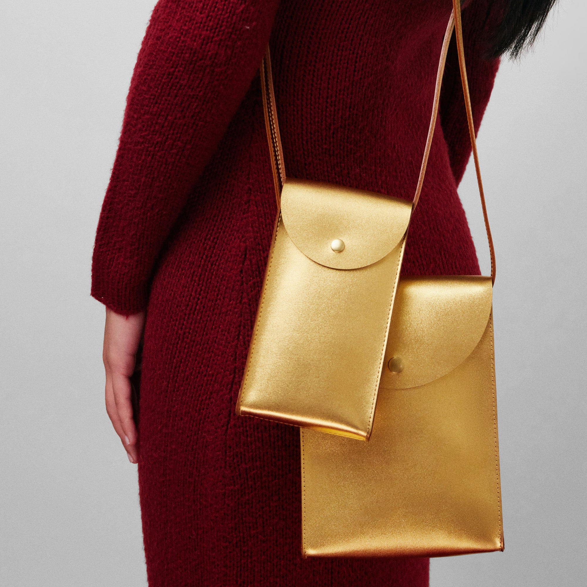 Mini Bandit crossbody bag in black full-grain leather, cropped view highlighting texture and stitching - Black