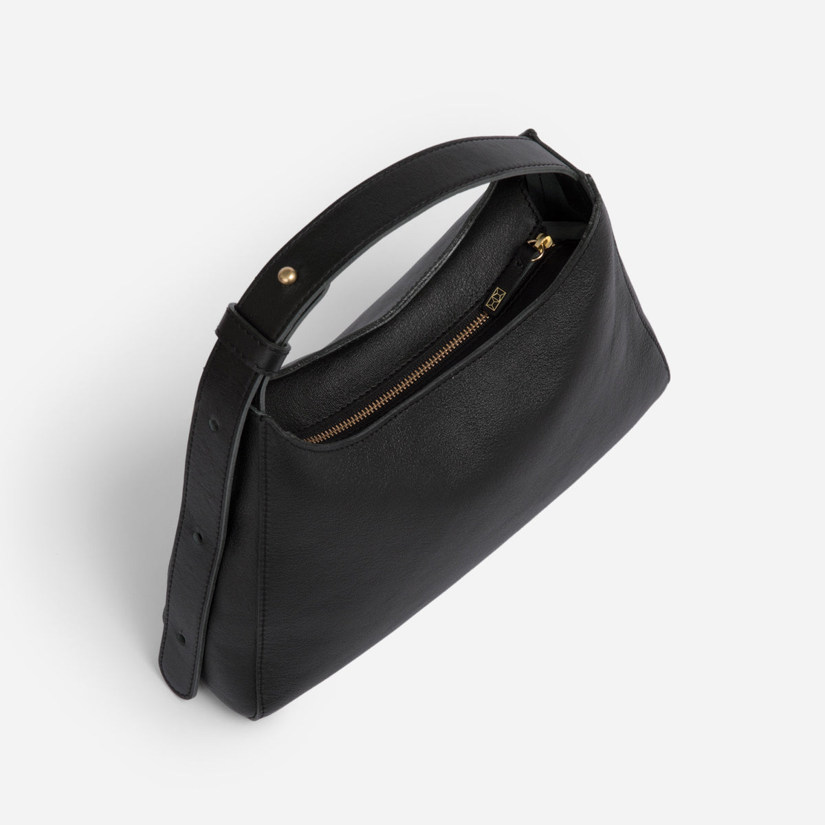 Black Overtime Tote Bag front view highlighting brass hardware - Black