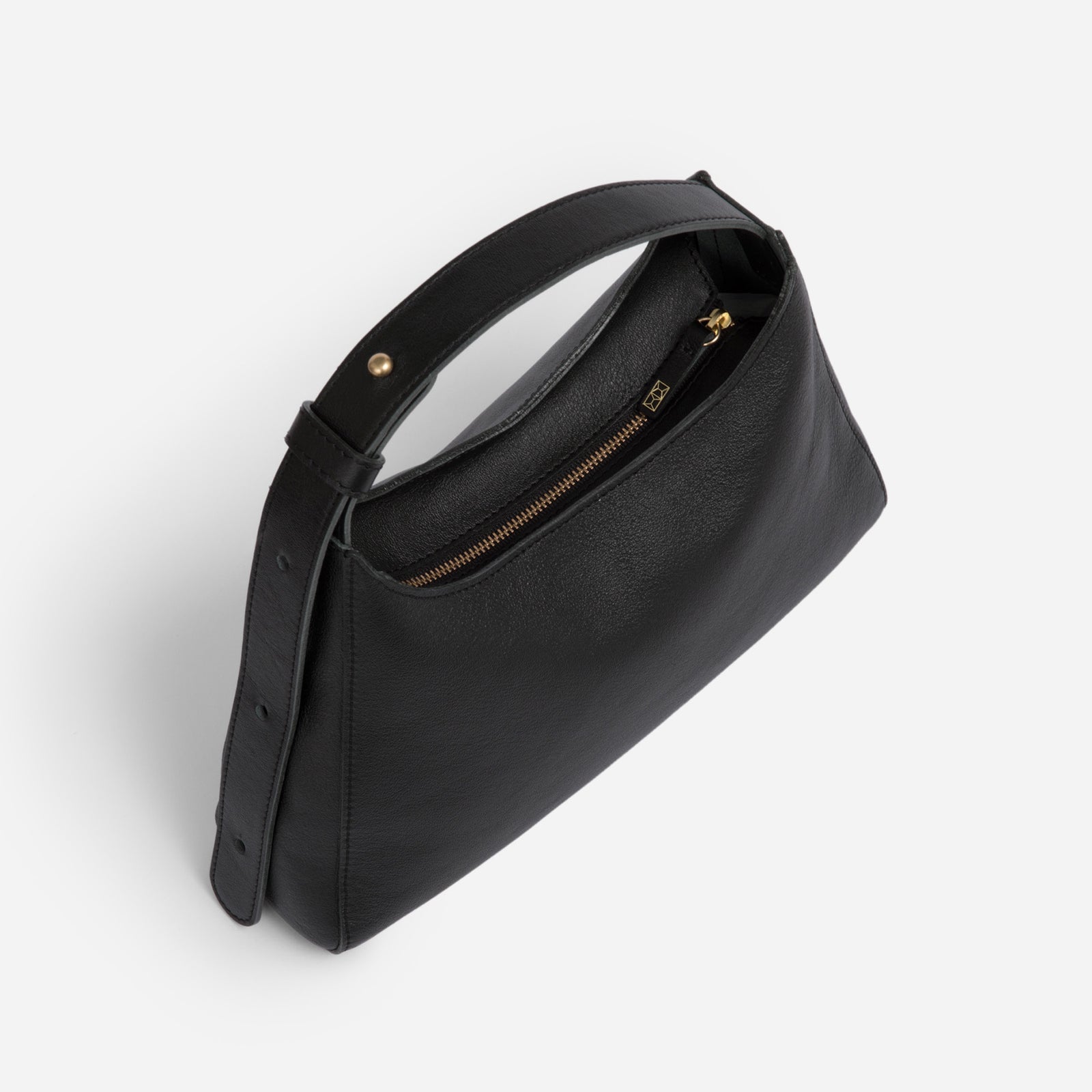 Black Overtime Tote Bag front view highlighting brass hardware - Black