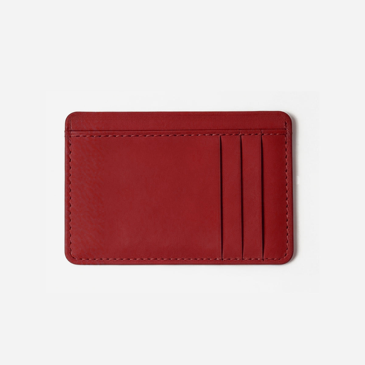 Red leather cardholder on a light gray background - Cherry Cola