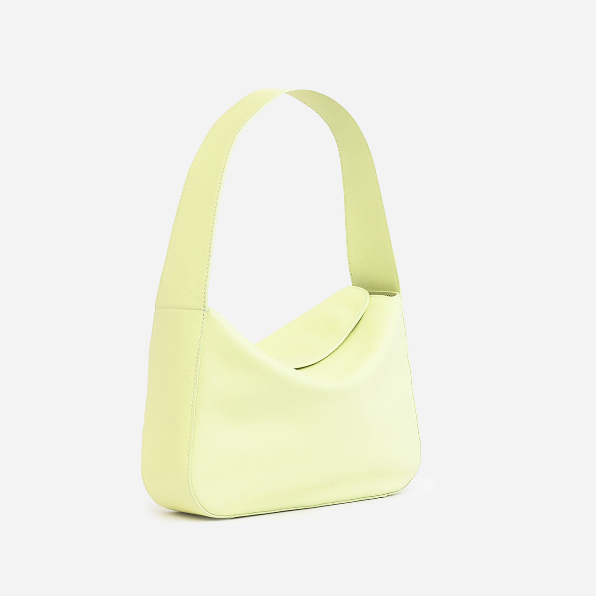 Frame Bag in luxury full-grain leather, styled as a shoulder bag with soft folds - Limelight