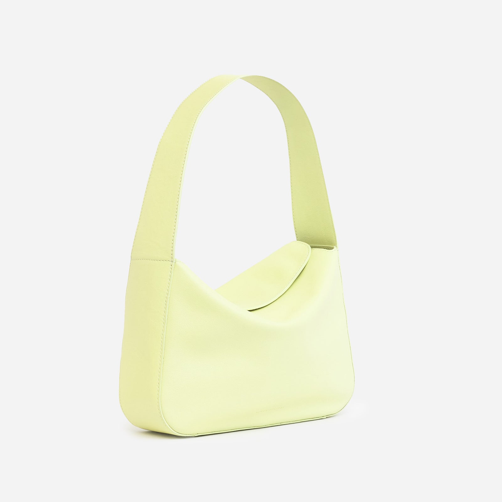 Frame Bag in luxury full-grain leather, styled as a shoulder bag with soft folds - Limelight