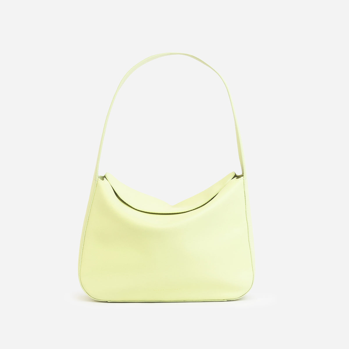 Frame Bag in luxury full-grain leather, styled as a shoulder bag with soft folds - Limelight