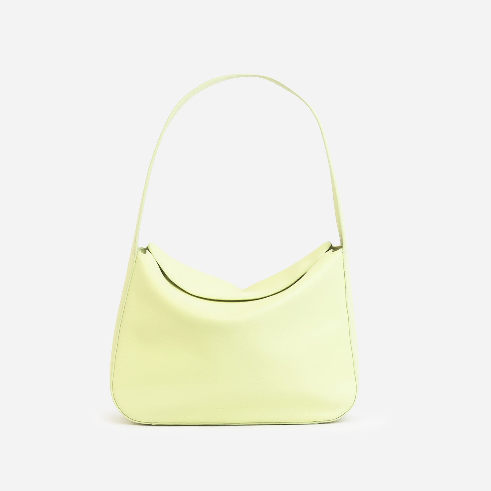 Frame Bag in luxury full-grain leather, styled as a shoulder bag with soft folds - Limelight