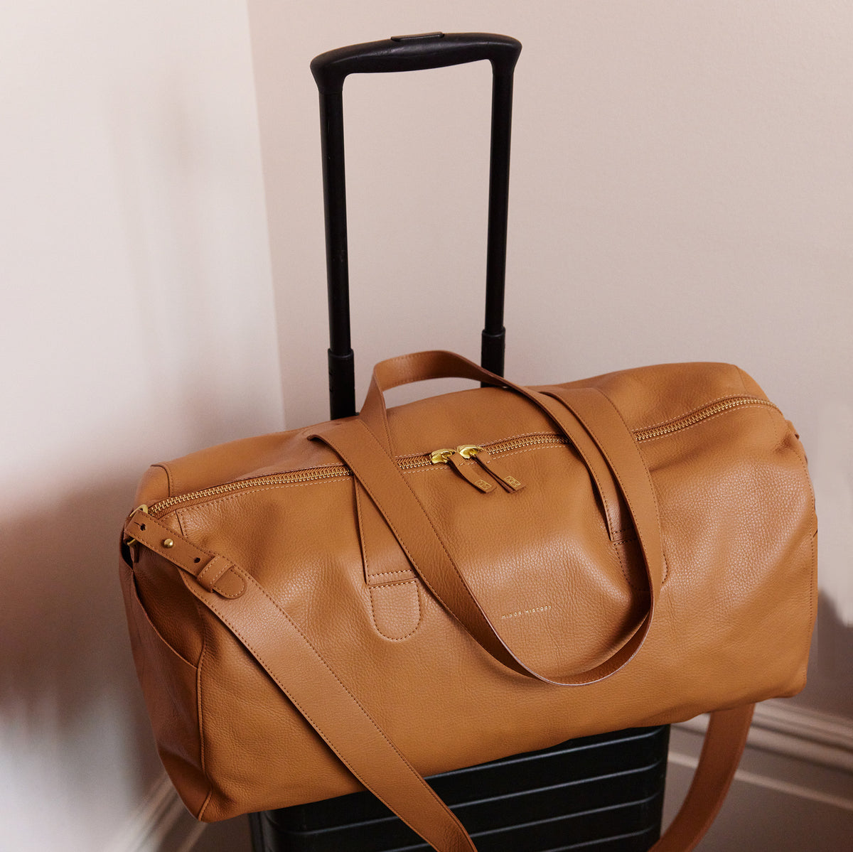 Saddle leather Getaway Duffle Bag, side profile - Saddle
