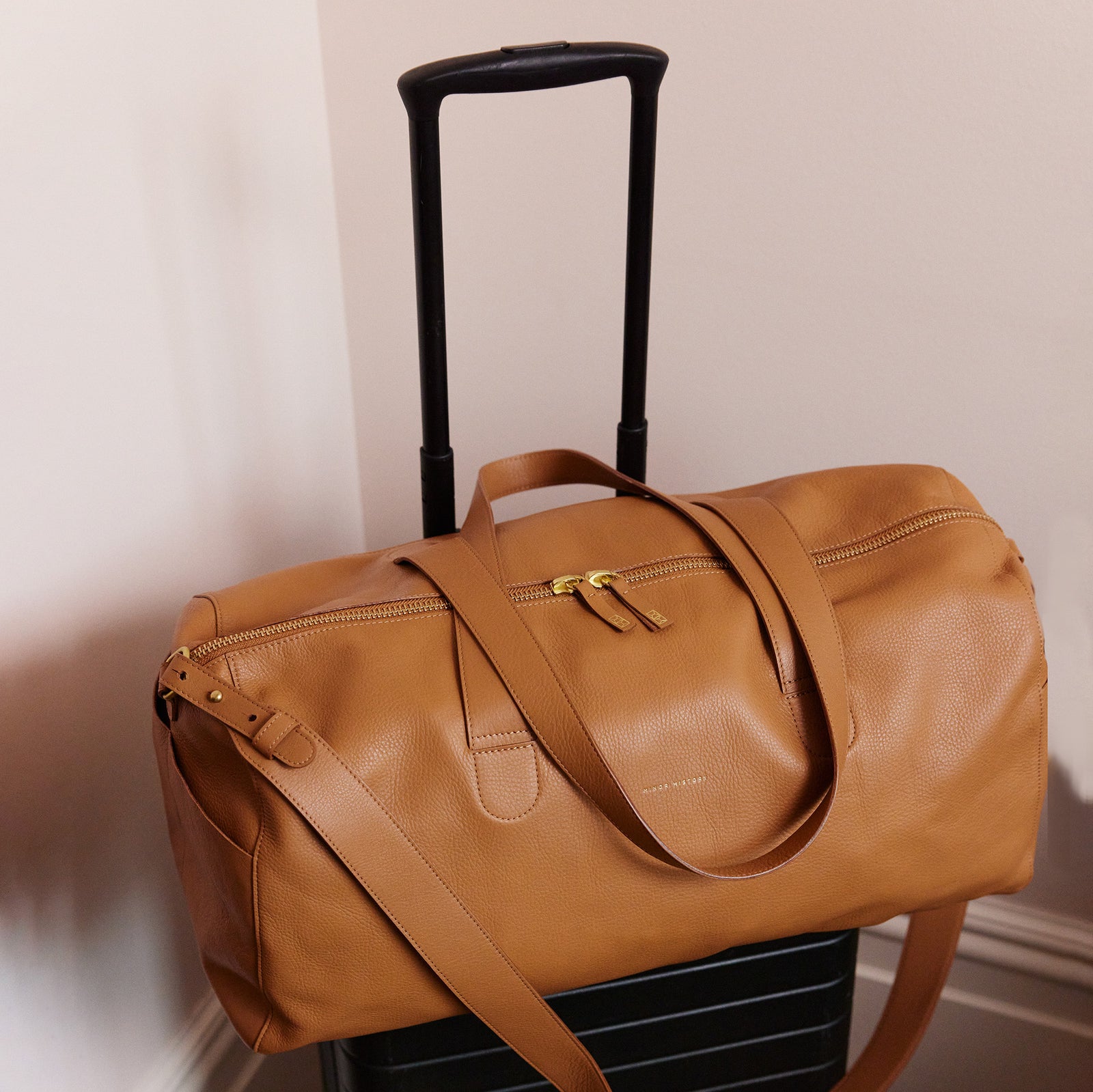 Saddle leather Getaway Duffle Bag, side profile - Saddle