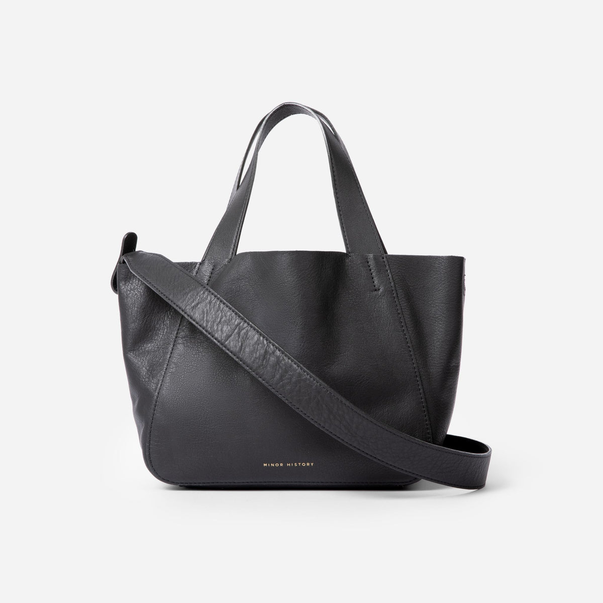 Black handbag with a shoulder strap on a white background - Black