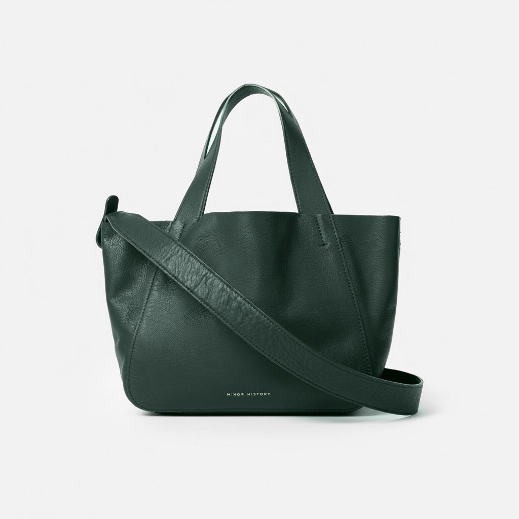 Black handbag with a shoulder strap on a white background - Black