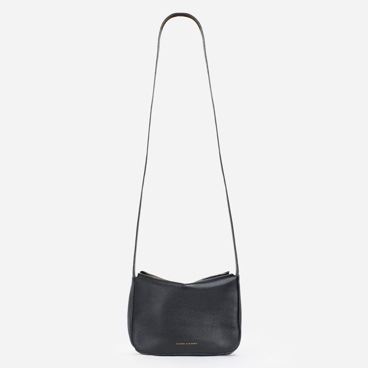 Little Frame crossbody bag in black full-grain leather, front view against a light background, minimalist women's handbag - Black