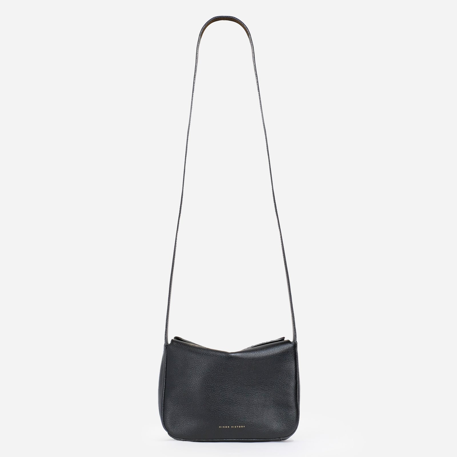 Little Frame crossbody bag in black full-grain leather, front view against a light background, minimalist women's handbag - Black