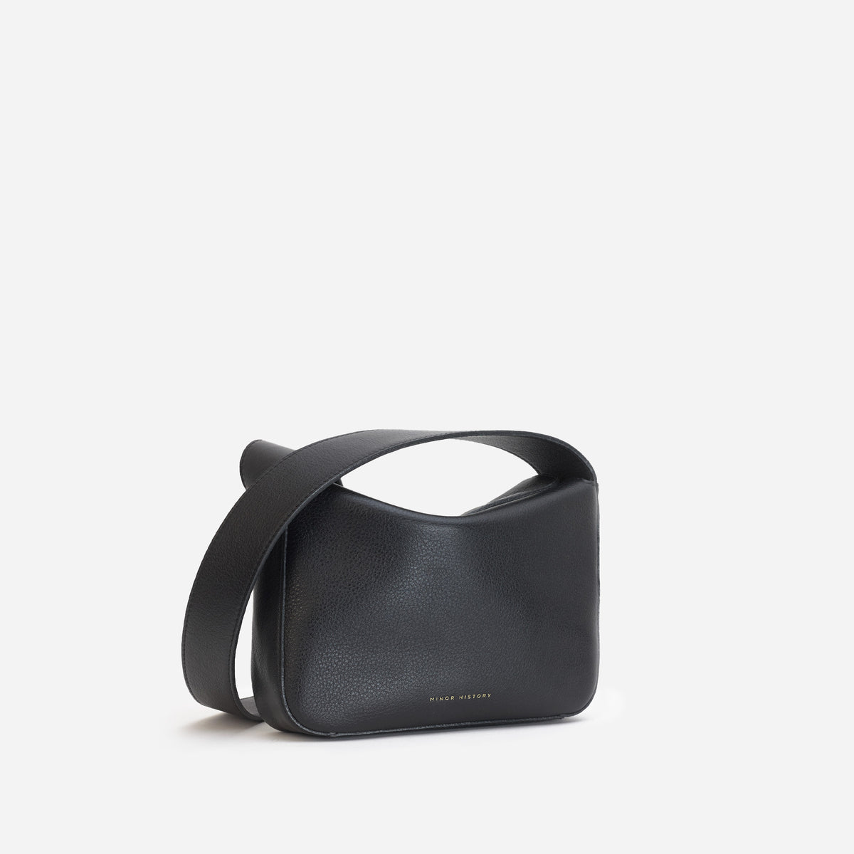 Little Frame crossbody bag in black full-grain leather, front view showcasing its sculpted shape, minimalist women's handbag - Black