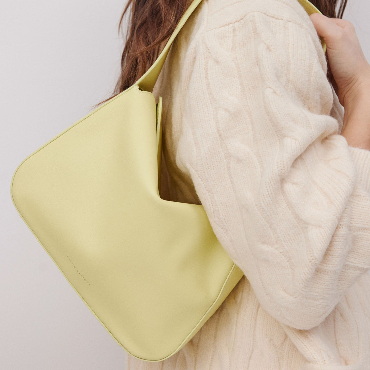 Frame Bag in luxury full-grain leather, detailed studio shot capturing texture and strap design - Limelight
