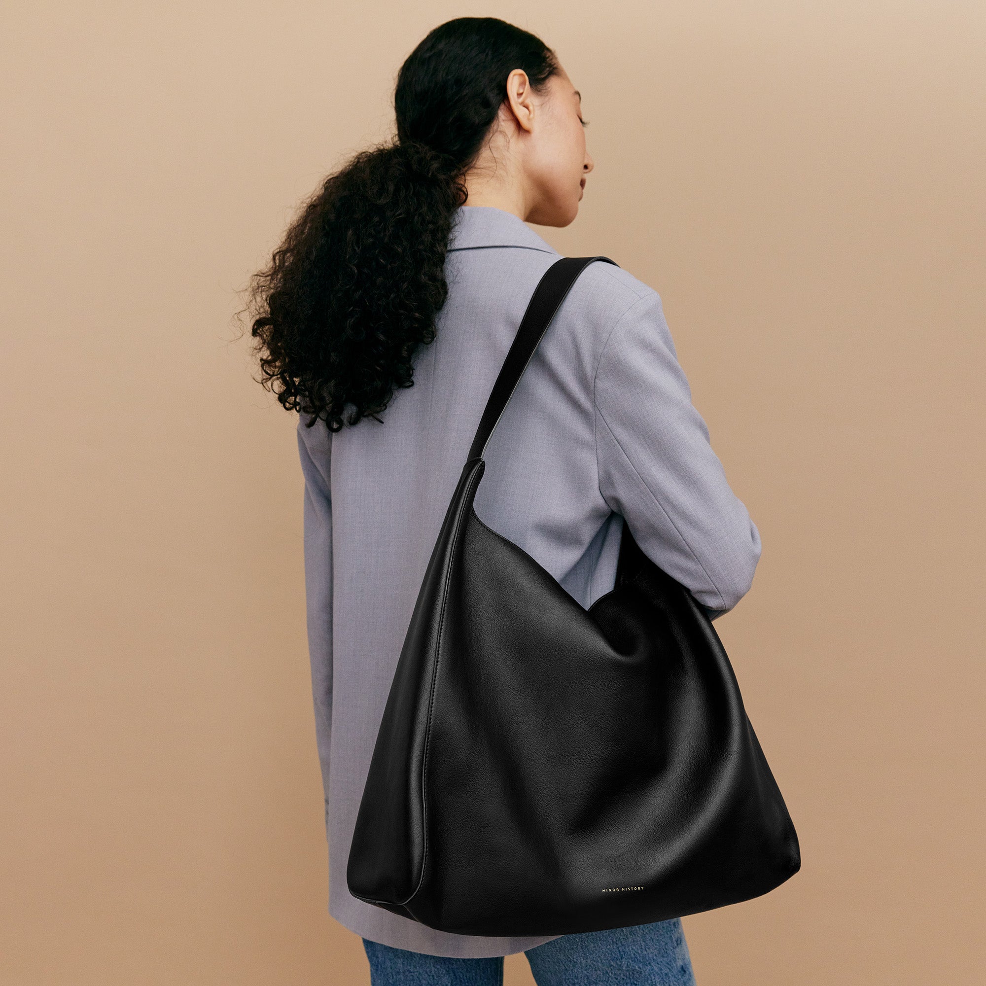 Black handbag on a white background - Black