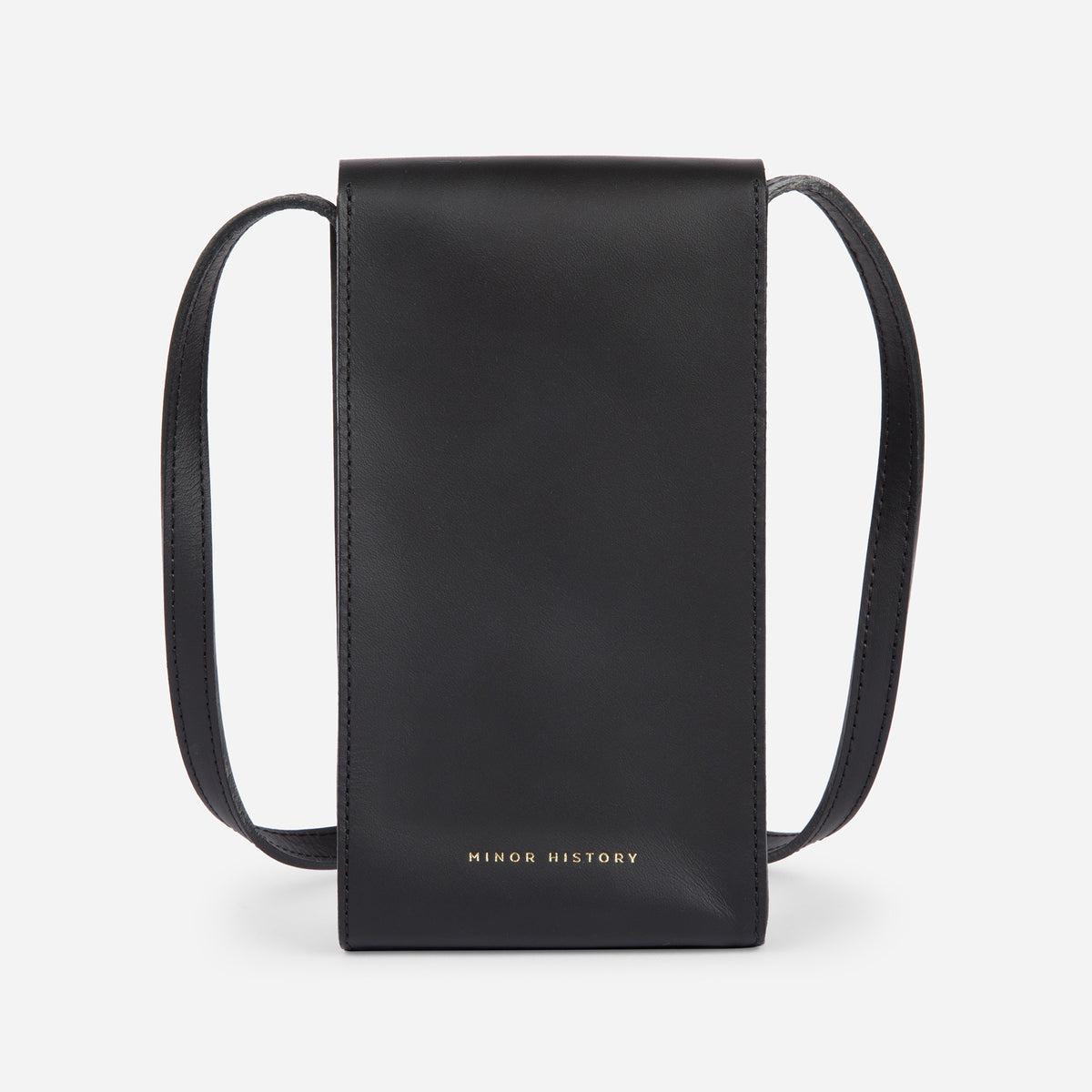 Mini Bandit crossbody bag in black full-grain leather, angled side view showing strap and shape - Black