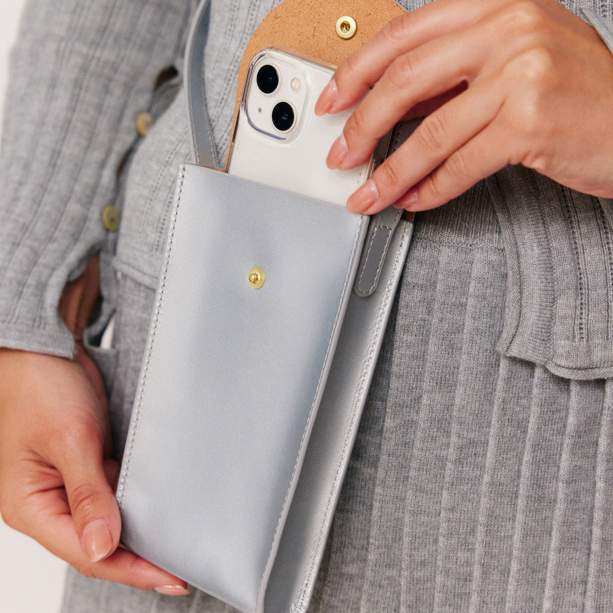 Mini Bandit crossbody bag in sterling silver full-grain leather, cropped view highlighting texture and stitching  - Sterling