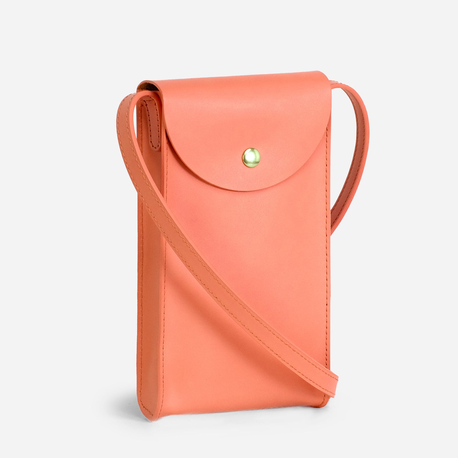 Mini Bandit crossbody bag in paloma pink full-grain leather, front view in bright studio setting - Paloma