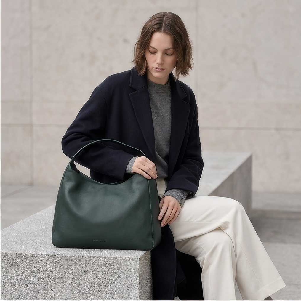Model carrying The Overtime Lite over the shoulder -Evergreen