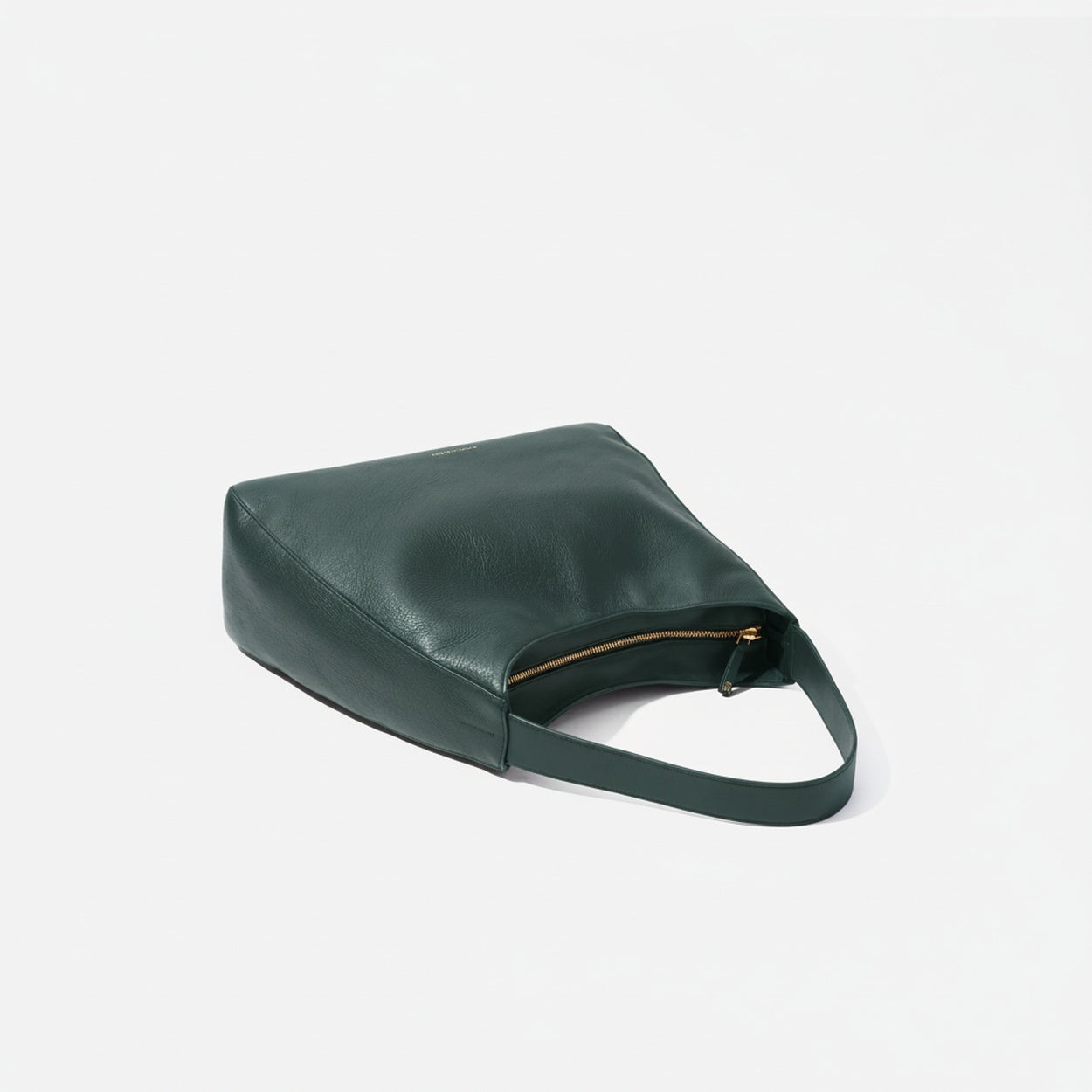Green handbag on a light gray background  -Evergreen