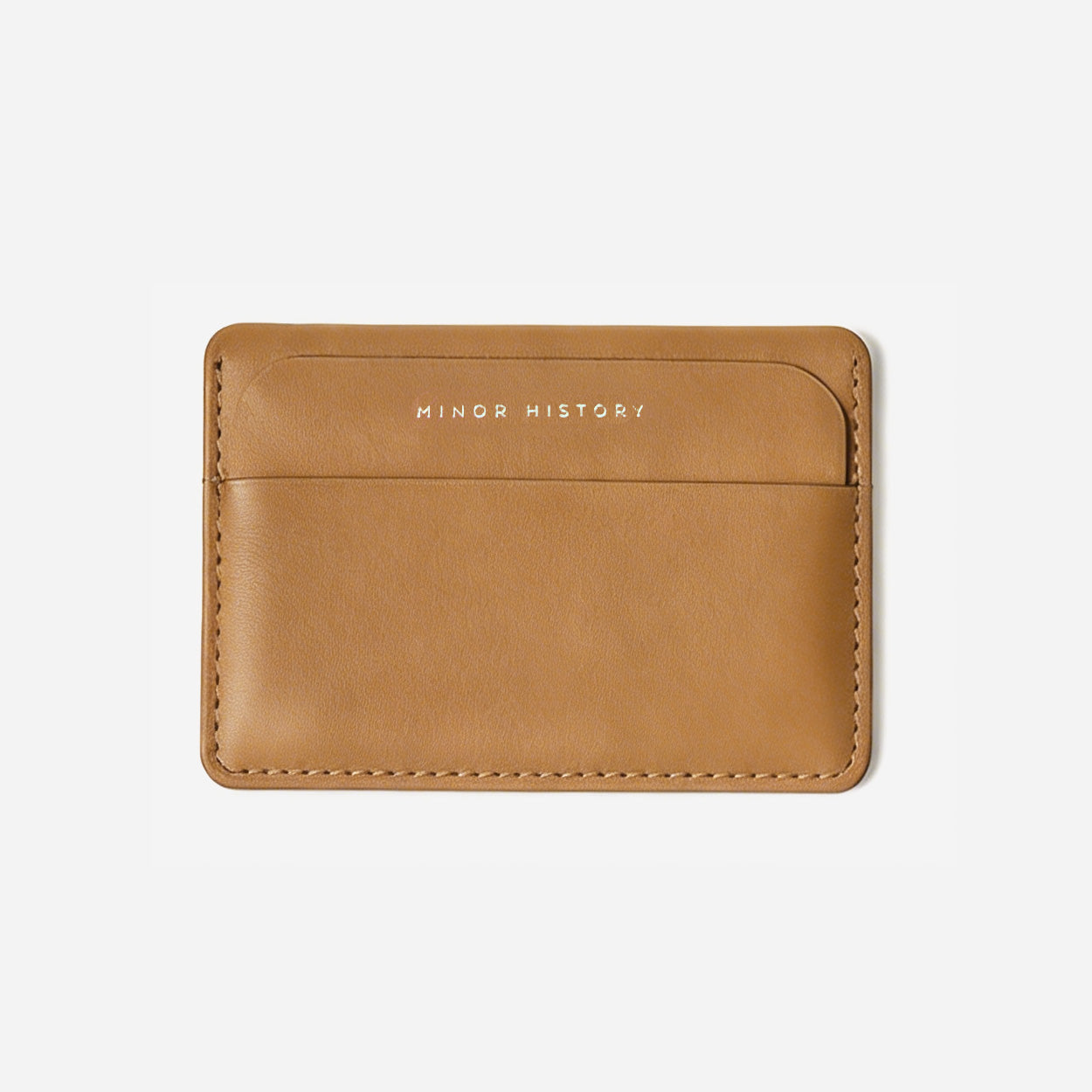 Gold cardholder with 'Ninety History' branding on a white background - Golden