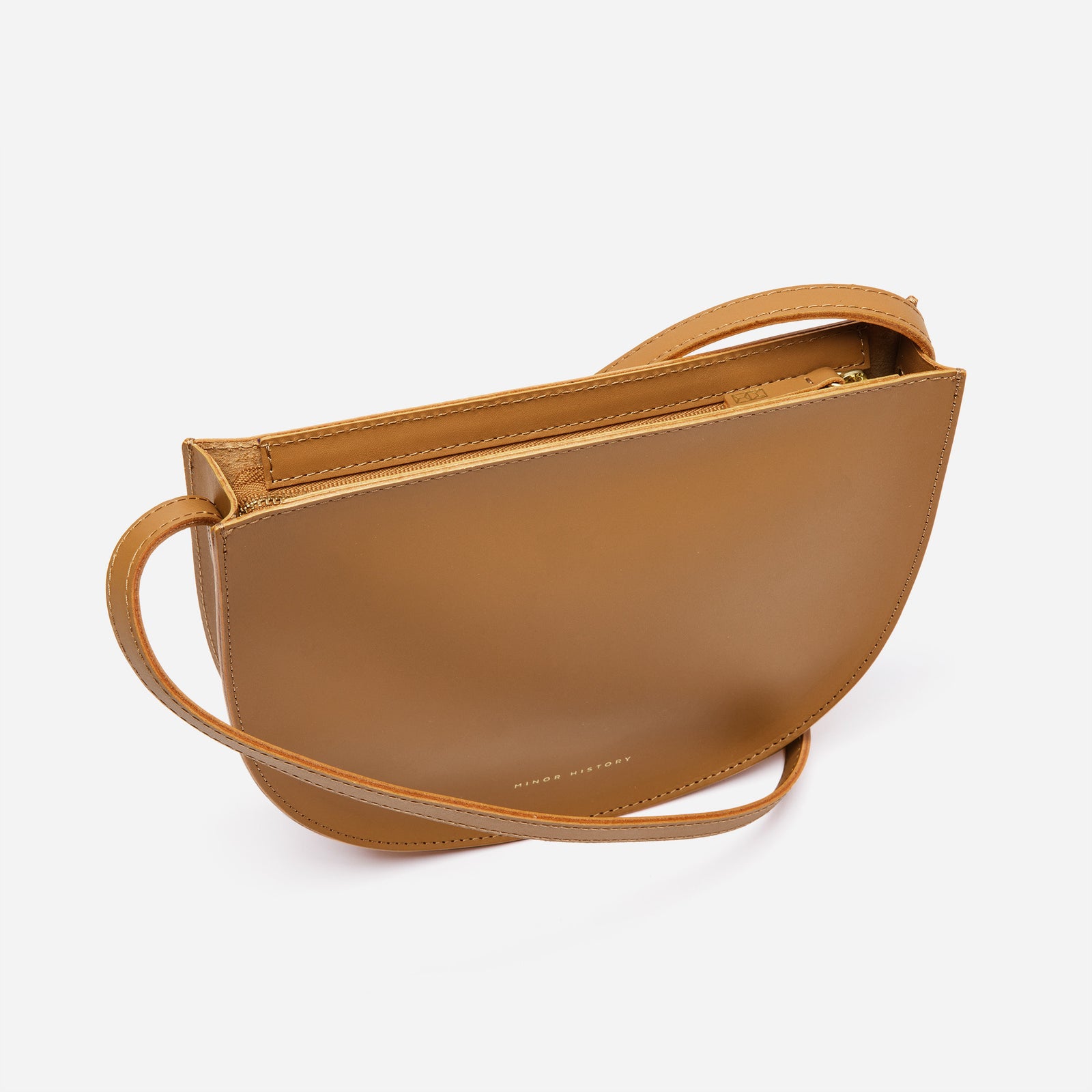 Minor History Sidekick Crossbody in saddle leather, flat lay - Saddle