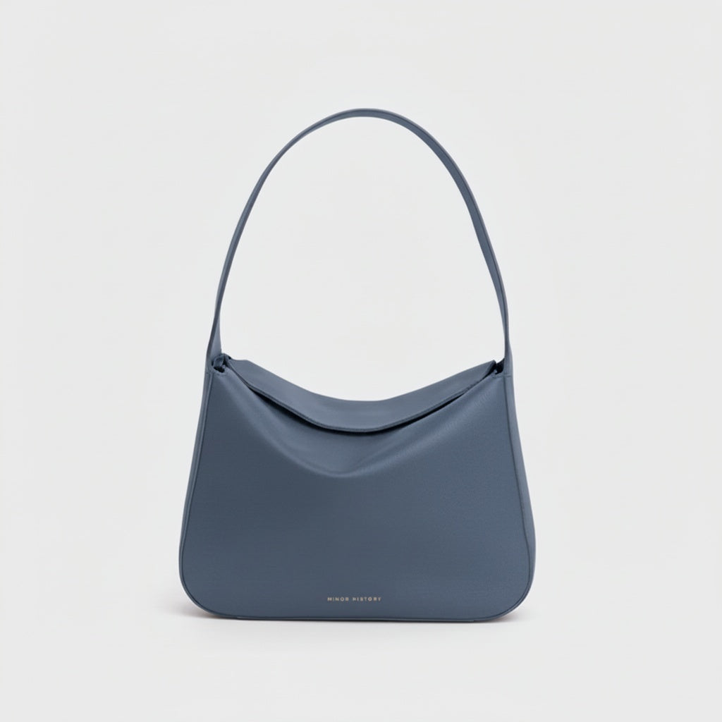 Blue handbag on a light gray background - Chambray
