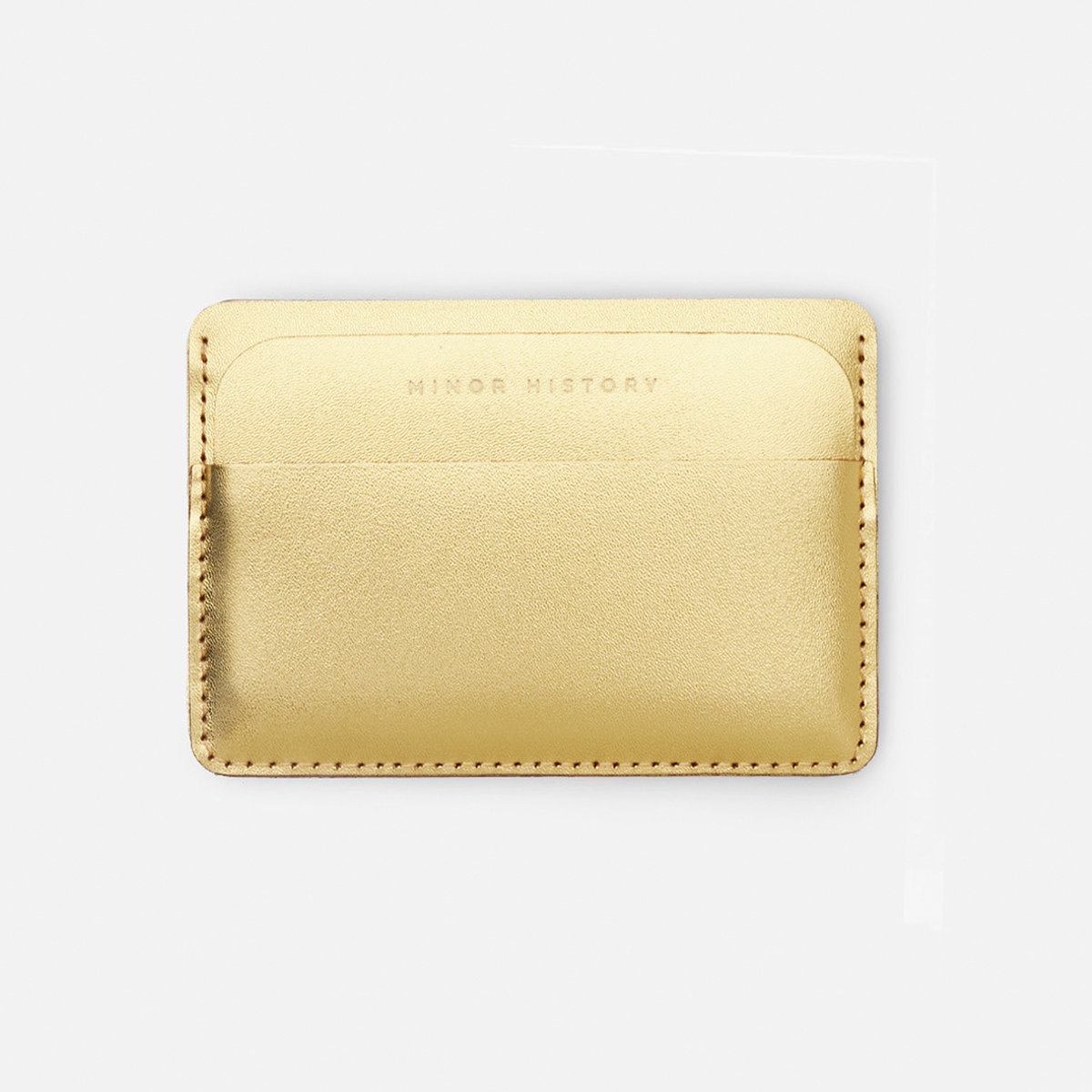 Gold cardholder with 'Ninety History' branding on a white background - Golden
