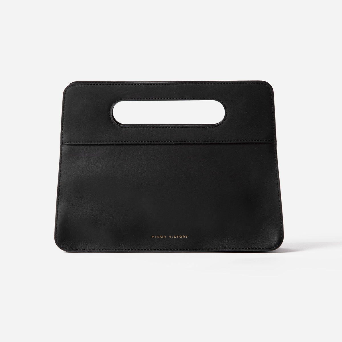 Lifestyle photo of Minor History leather bag - warm toned editorial setting  - Black